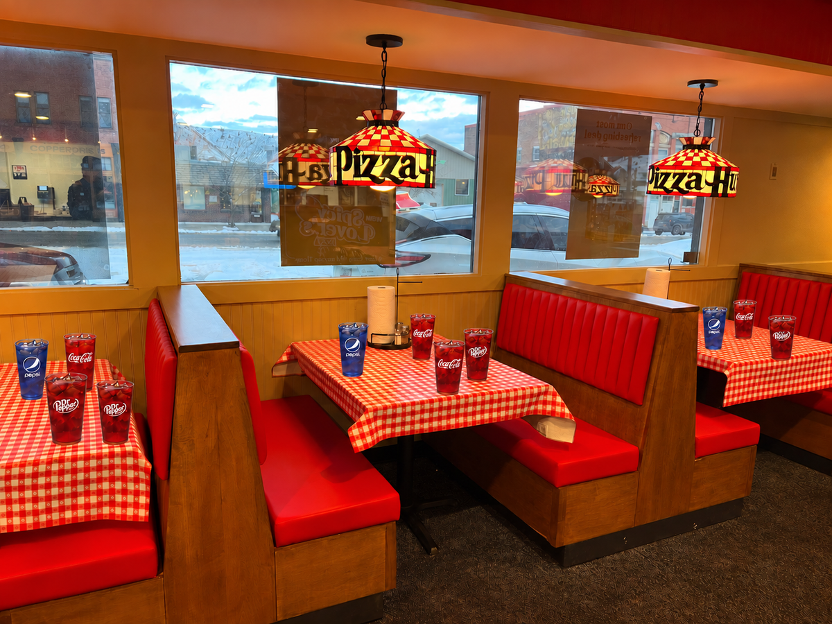 Classic red coke and blue pepsi restaurant cups in a nostalgic diner setting